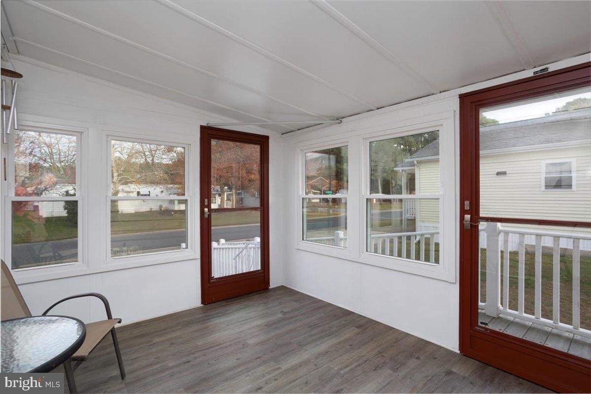 3 Park Lane Easton, MD 21601 - Photo 5 of 34 a view of an entryway with wooden floor and door