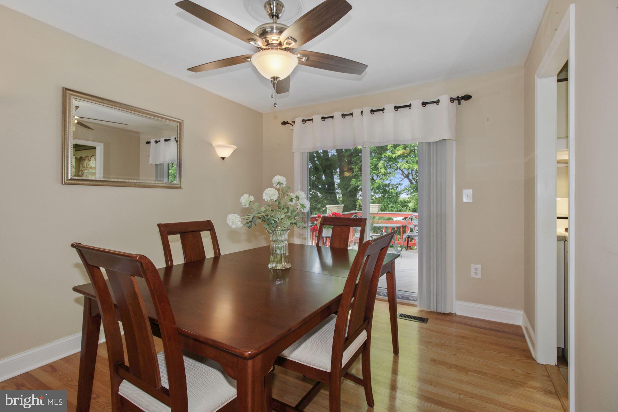 Dining Room | Hardwood Floors | Access to Deck