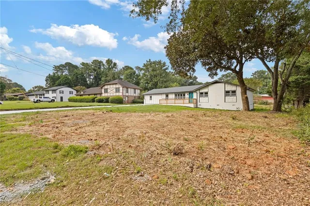 a house view with a garden space