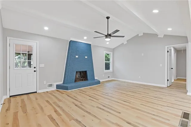 a very nice looking bedroom with a bed and a chandelier