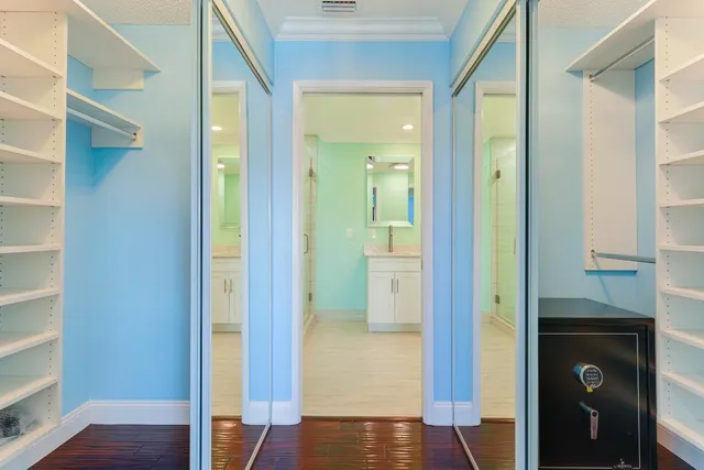 a view of a hallway with a wooden door