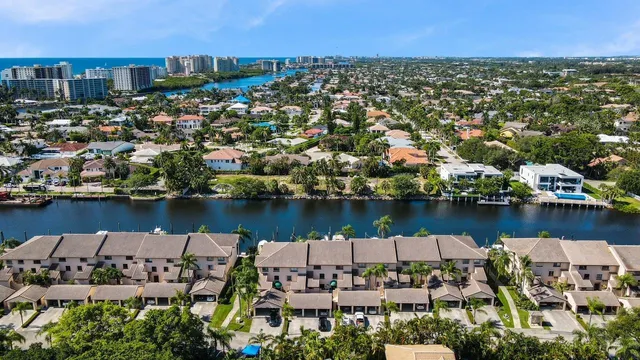 an aerial view of a house with a lake view