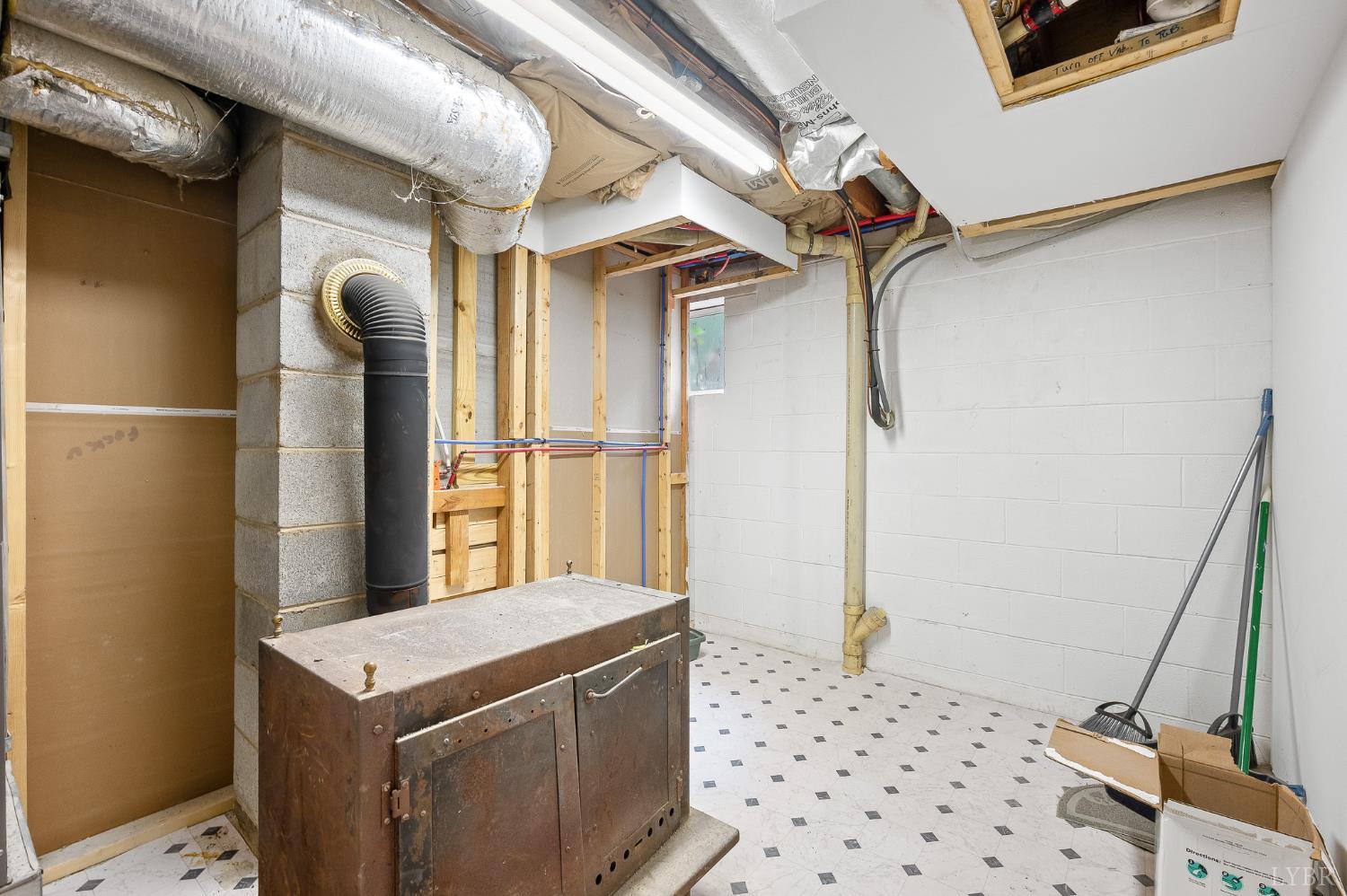969 Hawkins Road Evington, VA 24550 - Photo 33 of 40 The current sellers never used the woodstove. Recommend a chimney inspection prior to using it.