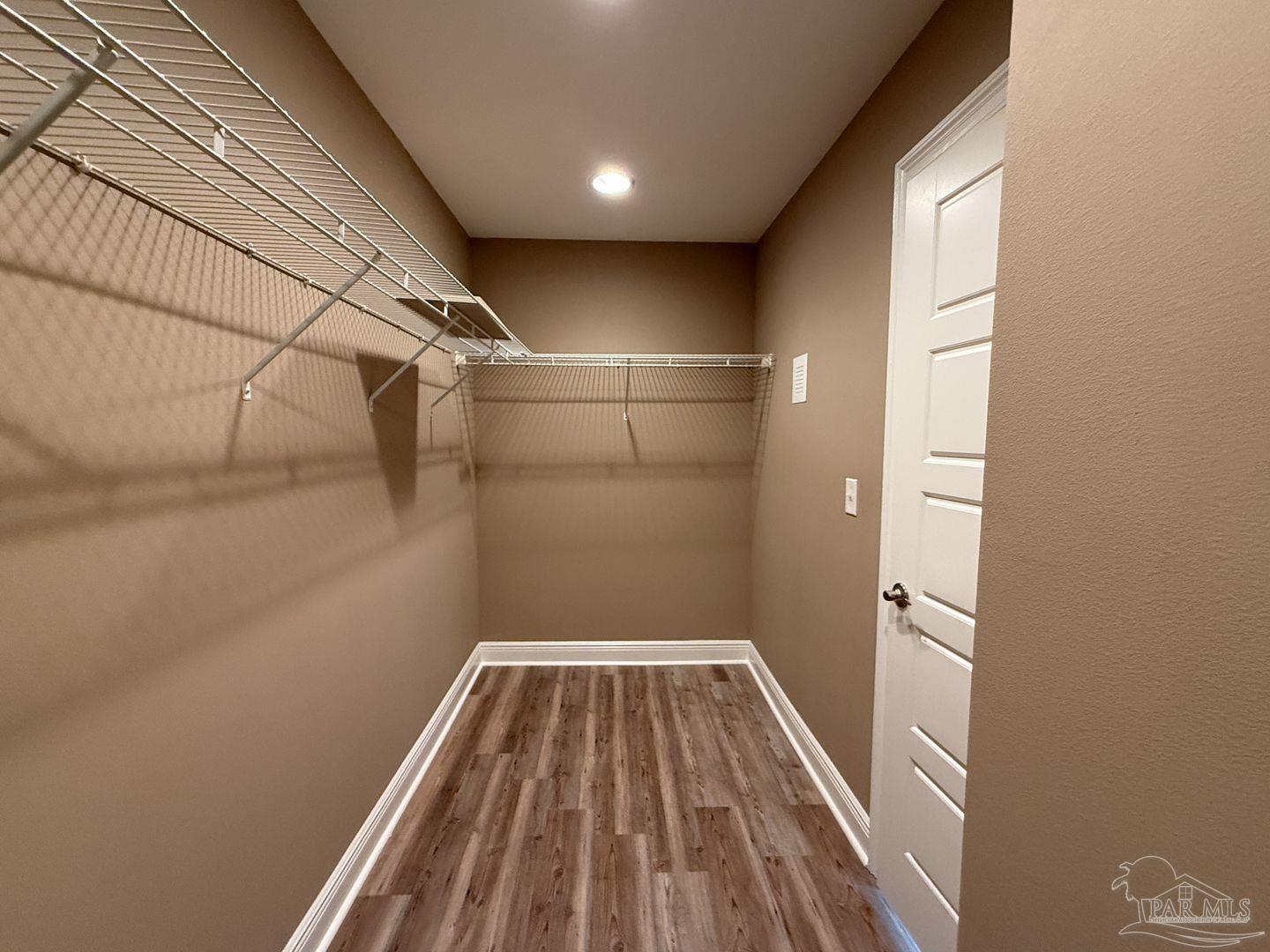 10423 Tanton Road Pensacola, FL 32506 - Photo 11 of 19 a view of a room with wooden floor