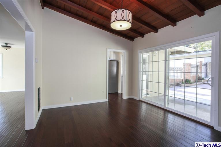 4465 Rising Hill Road Altadena, CA 91001 - Photo 12 of 45 a view of an empty room with wooden floor and a window