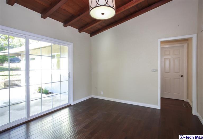4465 Rising Hill Road Altadena, CA 91001 - Photo 13 of 45 an empty room with wooden floor and windows