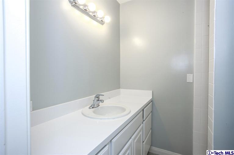 4465 Rising Hill Road Altadena, CA 91001 - Photo 22 of 45 a bathroom with a sink and a mirror