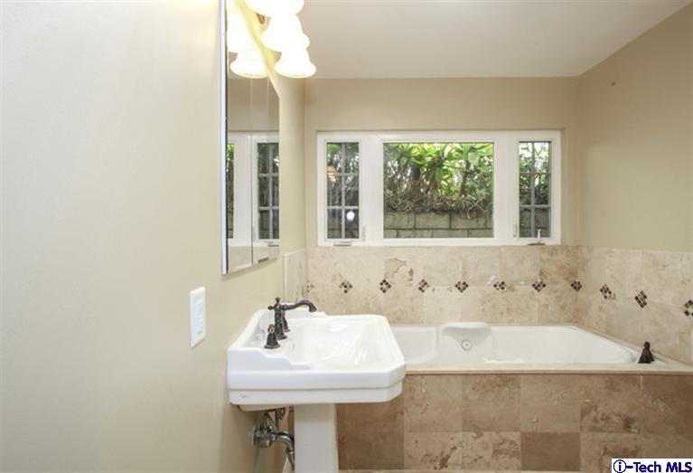 4465 Rising Hill Road Altadena, CA 91001 - Photo 23 of 45 a bathroom with a sink and a bathtub