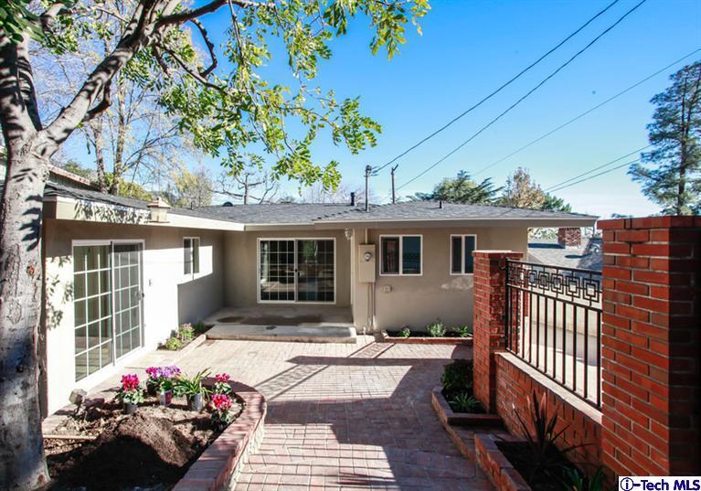 4465 Rising Hill Road Altadena, CA 91001 - Photo 37 of 45 a front view of a house with a garden