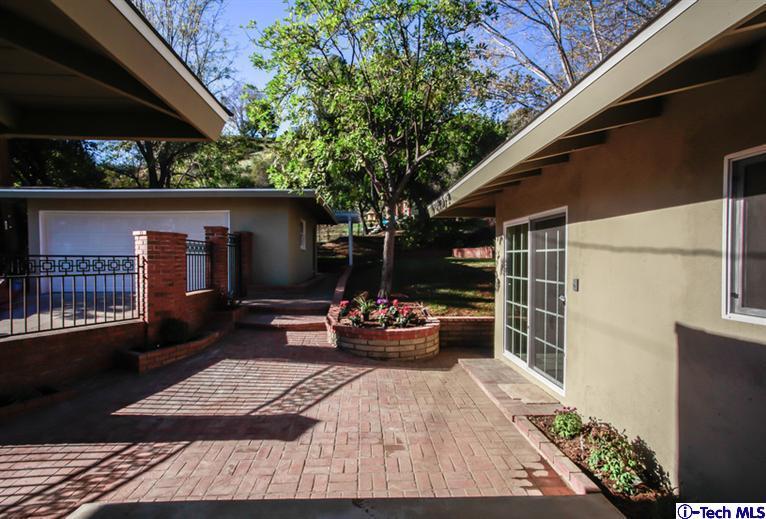 4465 Rising Hill Road Altadena, CA 91001 - Photo 38 of 45 a view of a patio with couches and potted plants
