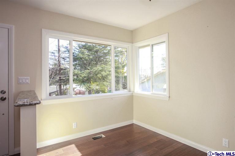 4465 Rising Hill Road Altadena, CA 91001 - Photo 7 of 45 an empty room with wooden floor and a window