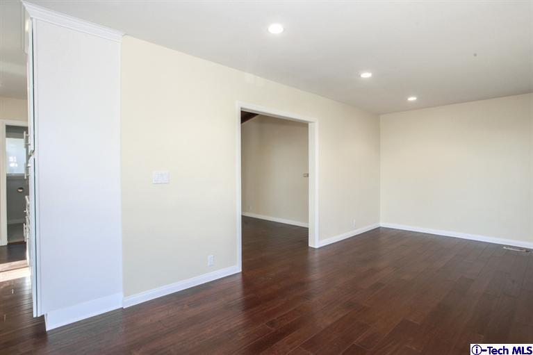 4465 Rising Hill Road Altadena, CA 91001 - Photo 8 of 45 an empty room with wooden floor & windows