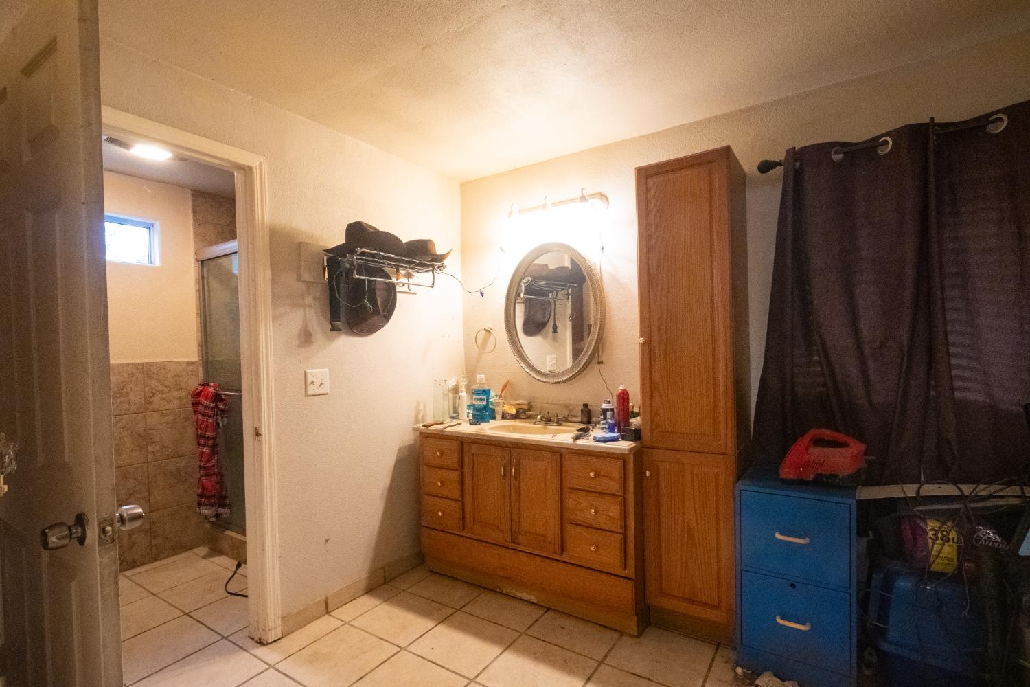 6401 South Chestnut Avenue Fresno, CA 93725 - Photo 15 of 36 a kitchen with a sink and a mirror