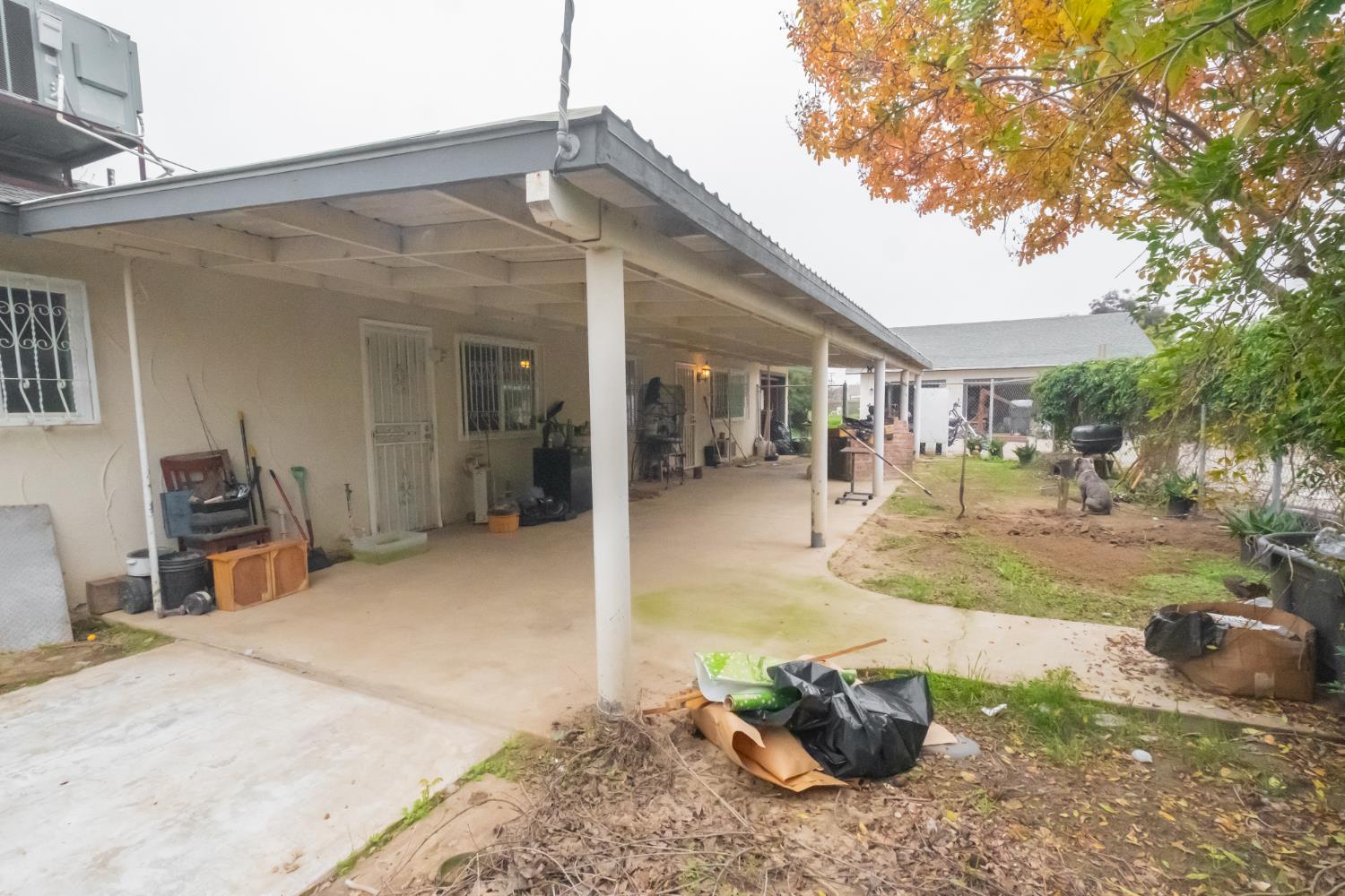 6401 South Chestnut Avenue Fresno, CA 93725 - Photo 20 of 36 a view of a patio with table and chairs and potted plants