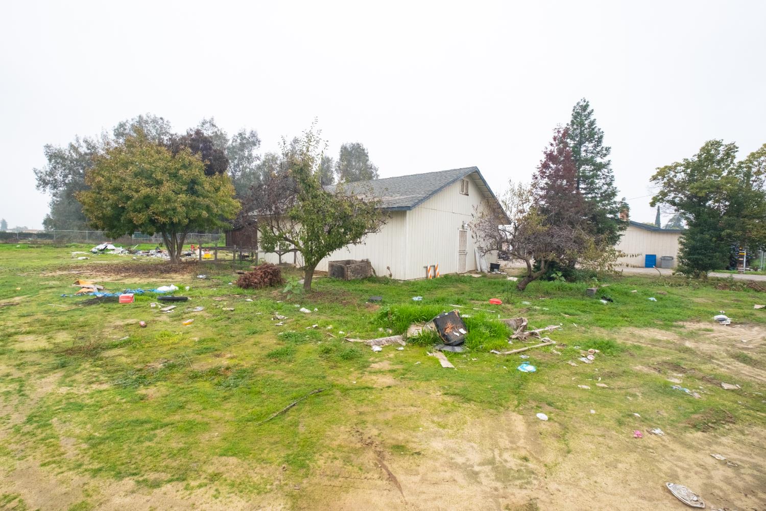 6401 South Chestnut Avenue Fresno, CA 93725 - Photo 21 of 36 a view of a house with a yard garage and tree