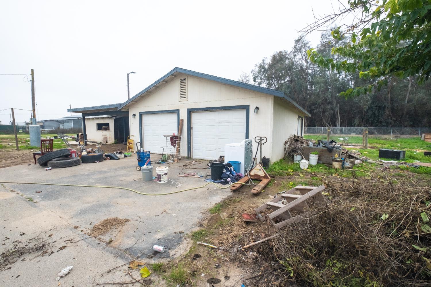 6401 South Chestnut Avenue Fresno, CA 93725 - Photo 31 of 36 a view of backyard of house with car and outdoor seating