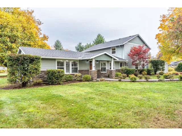 a front view of house with yard and green space