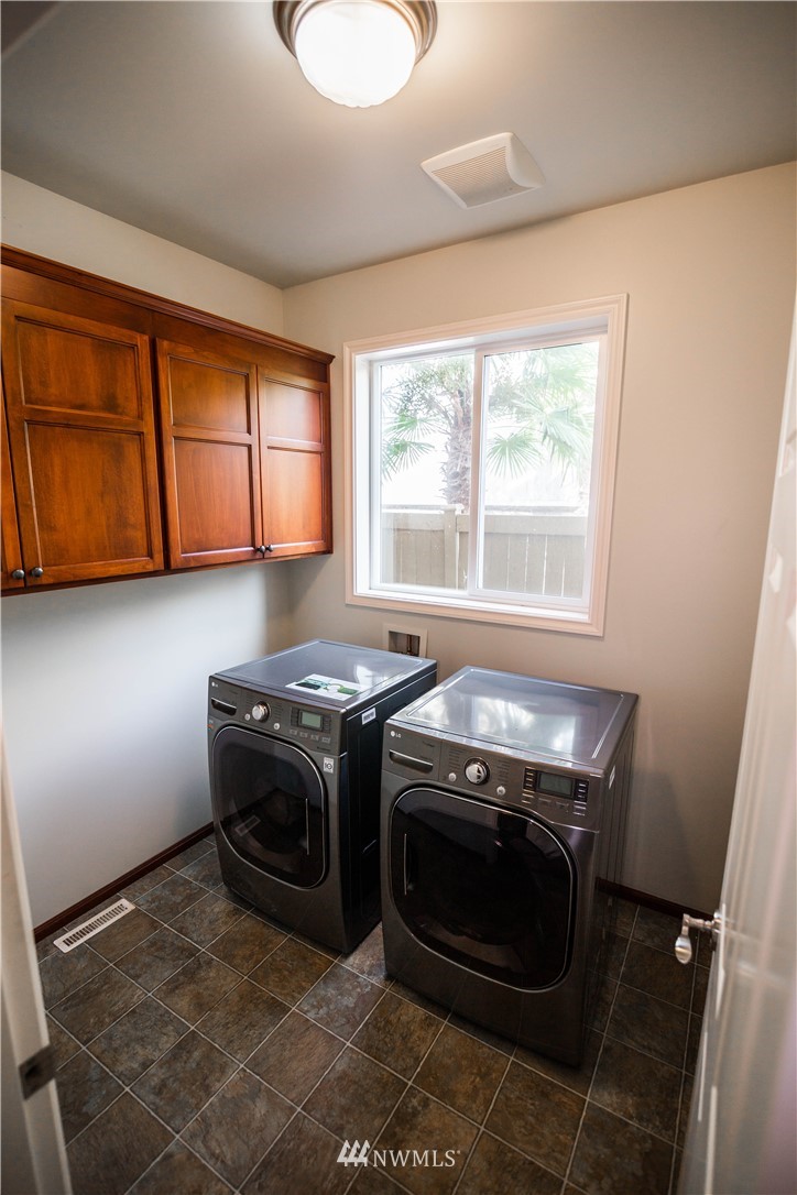 1026 South 36th Place Renton, WA 98055 - Photo 11 of 25 a stove top oven sitting inside of a kitchen