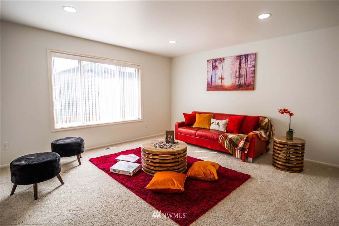 1026 South 36th Place Renton, WA 98055 - Photo 14 of 25 a living room with furniture and a window