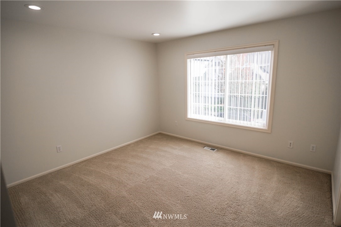 1026 South 36th Place Renton, WA 98055 - Photo 21 of 25 an empty room with a window