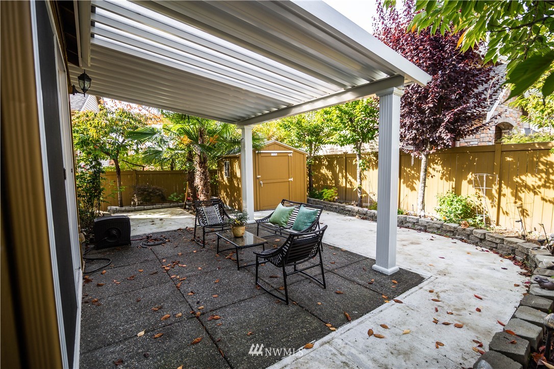 1026 South 36th Place Renton, WA 98055 - Photo 24 of 25 a backyard of a house with a table and chairs
