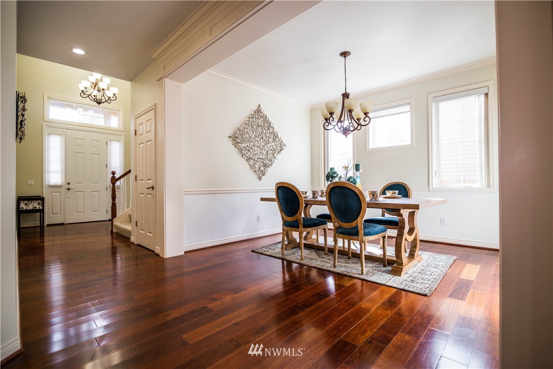 1026 South 36th Place Renton, WA 98055 - Photo 5 of 25 a view of a dining room with furniture window and wooden floor