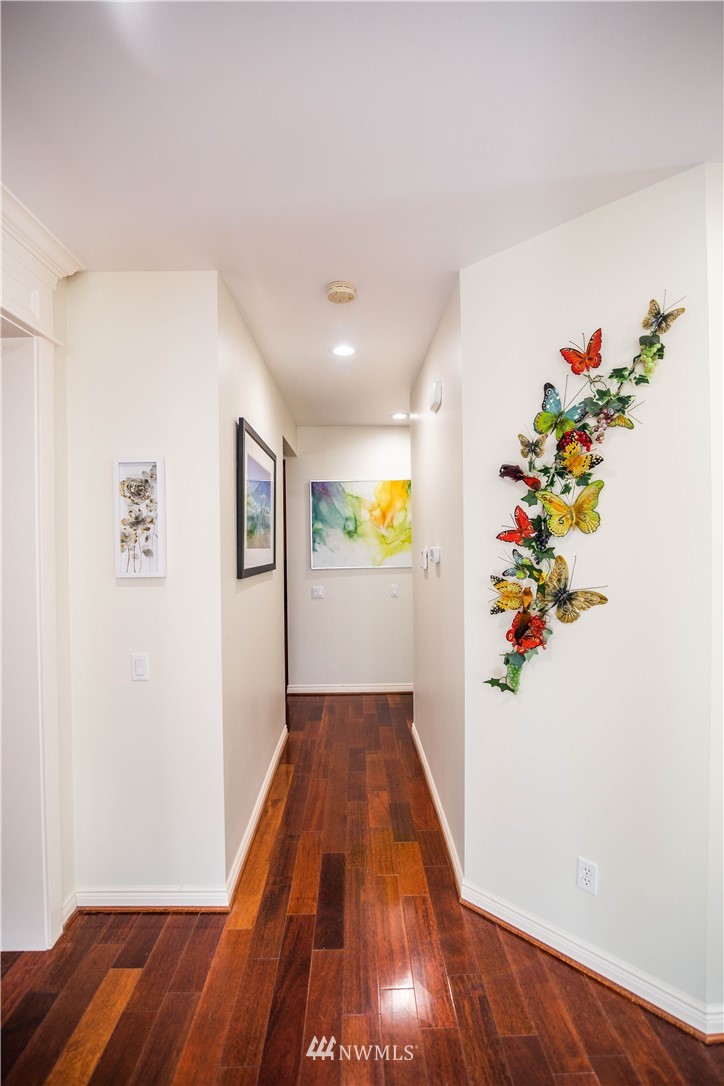 1026 South 36th Place Renton, WA 98055 - Photo 10 of 25 a view of a hallway with wooden floor