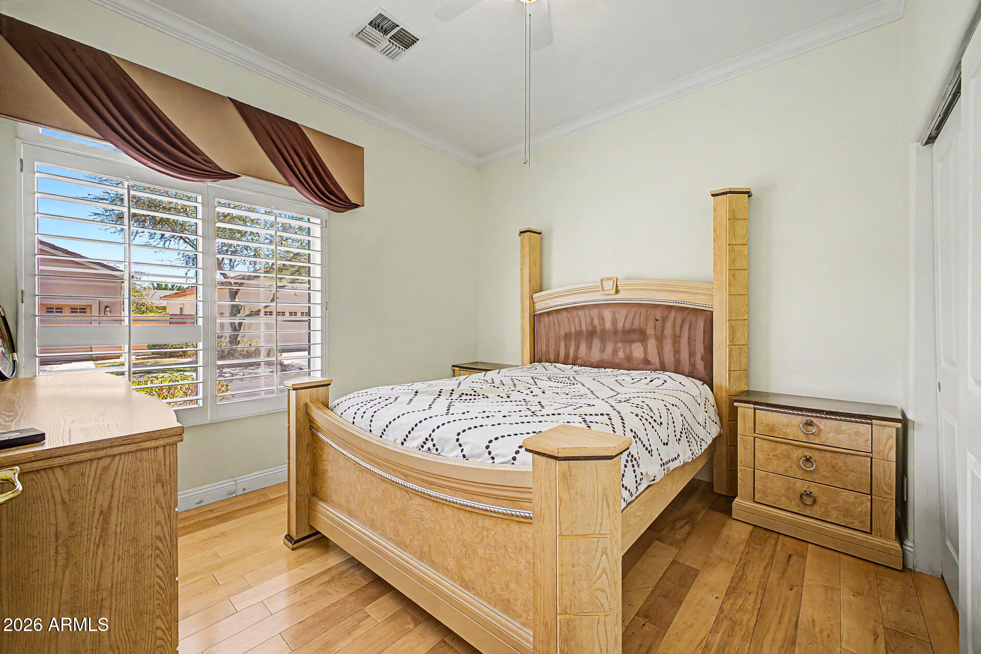 808 West Citrus Way Phoenix, AZ 85013 - Photo 22 of 35 a bed sitting in a bedroom next to a window
