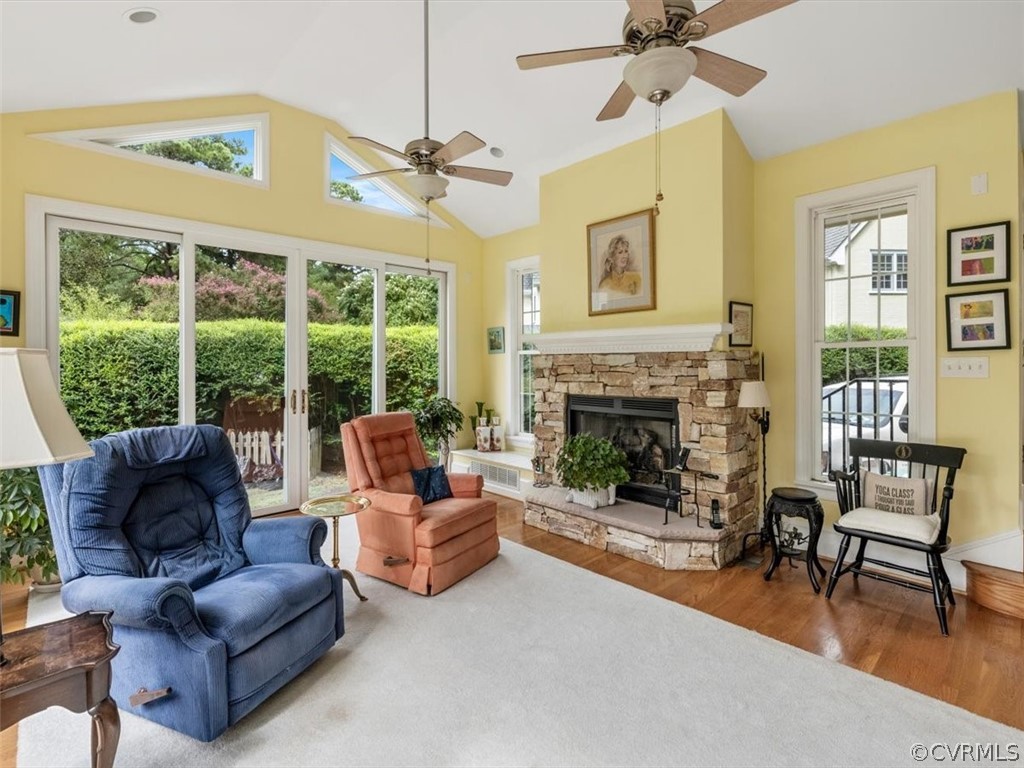7100 River Road Henrico, VA 23229 - Photo 16 of 32 a living room with furniture a fireplace and a floor to ceiling window