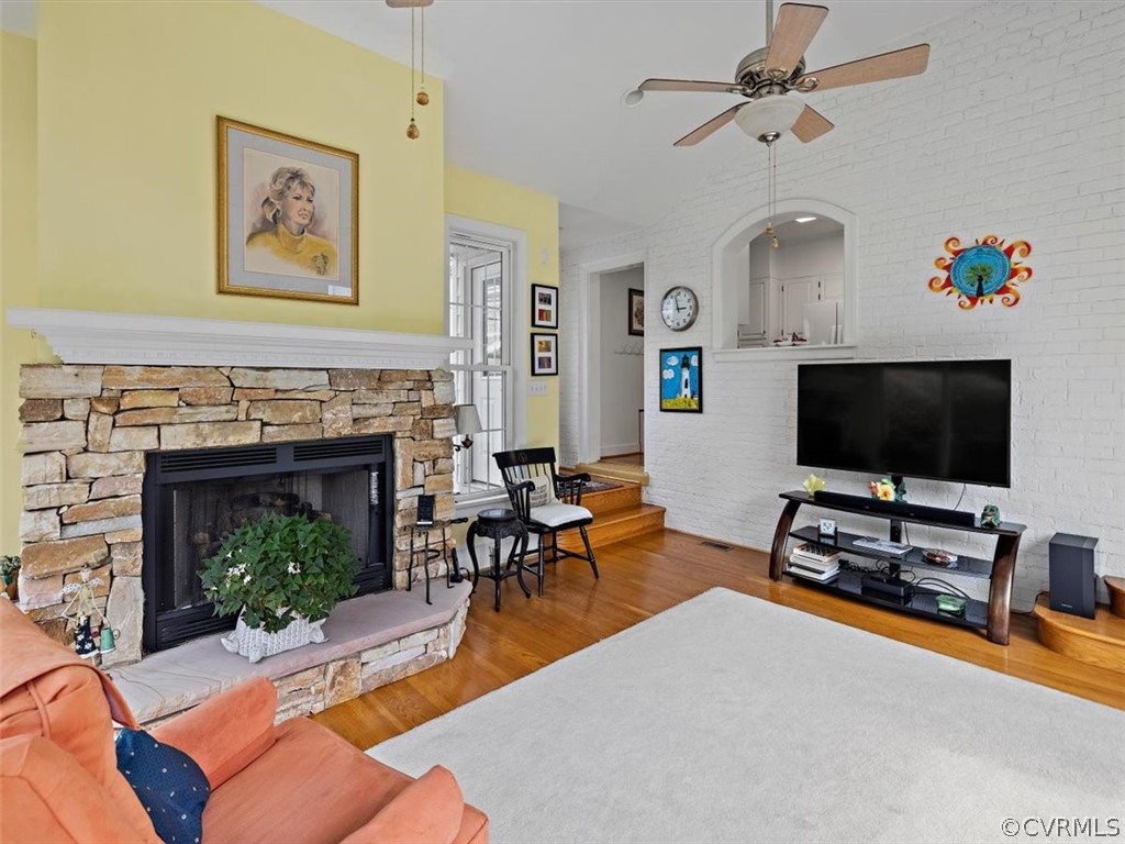 7100 River Road Henrico, VA 23229 - Photo 17 of 32 a living room with furniture a fireplace and a flat screen tv