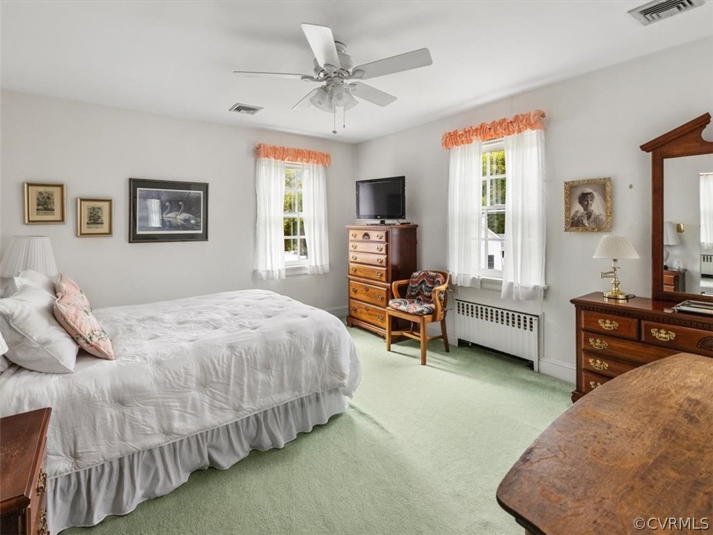 7100 River Road Henrico, VA 23229 - Photo 20 of 32 a bed room with a bed and a couch