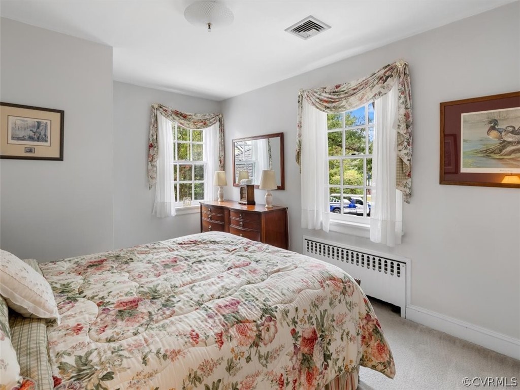 7100 River Road Henrico, VA 23229 - Photo 23 of 32 a bedroom with a bed and a window
