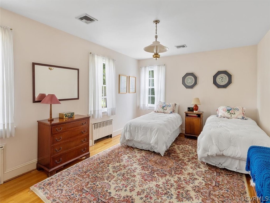 7100 River Road Henrico, VA 23229 - Photo 24 of 32 a spacious bedroom with a bed and a dresser in it
