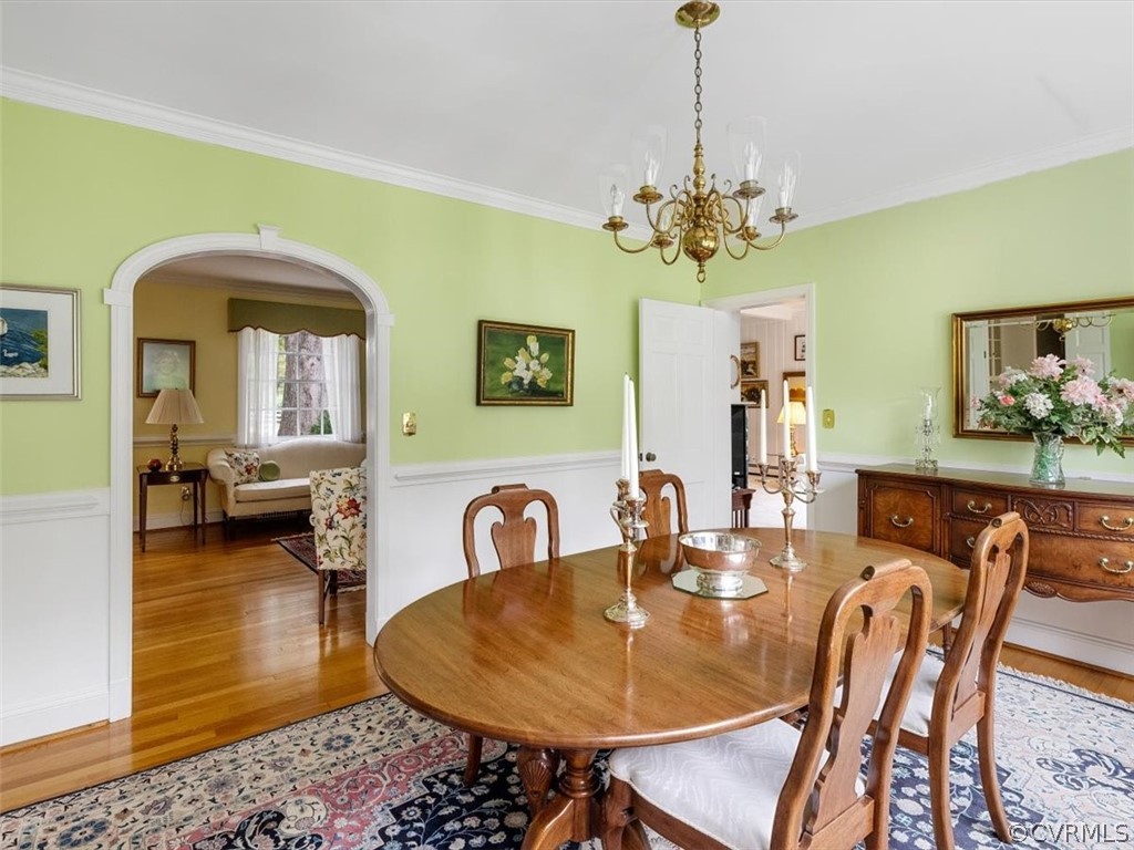 7100 River Road Henrico, VA 23229 - Photo 10 of 32 a dining room with furniture and a chandelier