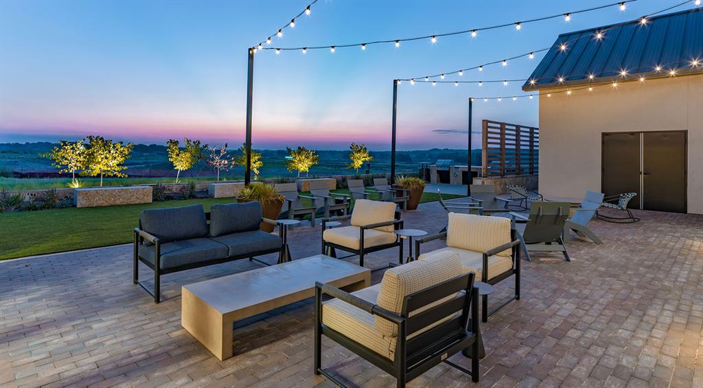 854 Stoney Bridge Way Lavon, TX 75166 - Photo 14 of 14 a outdoor living space with furniture and a potted plant