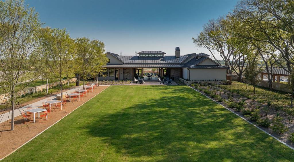 854 Stoney Bridge Way Lavon, TX 75166 - Photo 5 of 14 a view of a house with a big yard and large trees