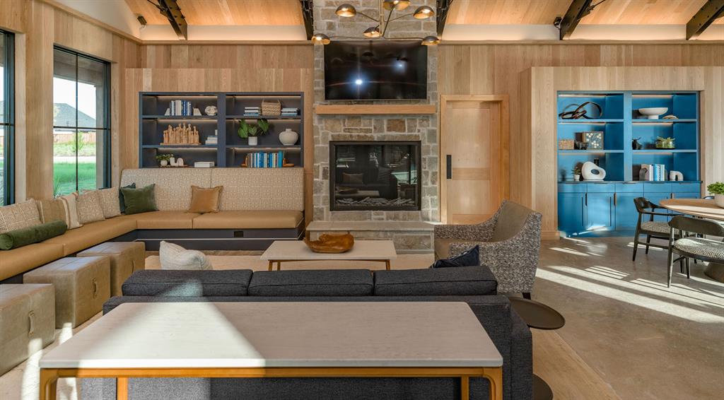 854 Stoney Bridge Way Lavon, TX 75166 - Photo 7 of 14 a living room with furniture a fireplace and a flat screen tv