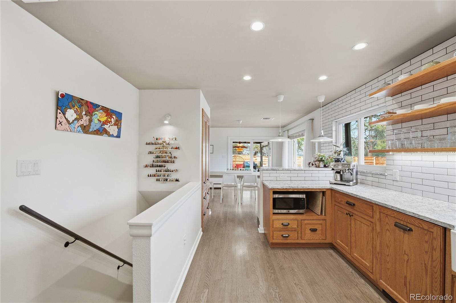 5974 South Pennsylvania Street Centennial, CO 80121 - Photo 11 of 46 a kitchen with stainless steel appliances sink stove and cabinets
