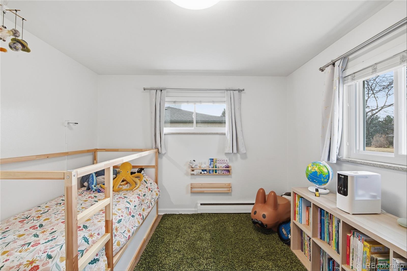 5974 South Pennsylvania Street Centennial, CO 80121 - Photo 16 of 46 a bedroom with furniture and a window