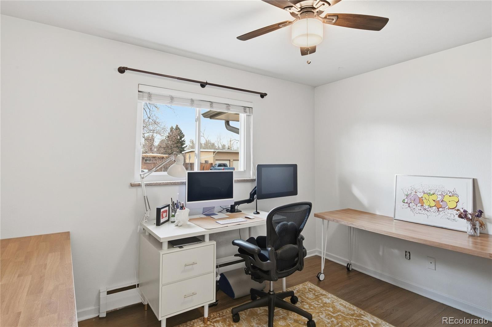 5974 South Pennsylvania Street Centennial, CO 80121 - Photo 19 of 46 a workspace with a desk and a window