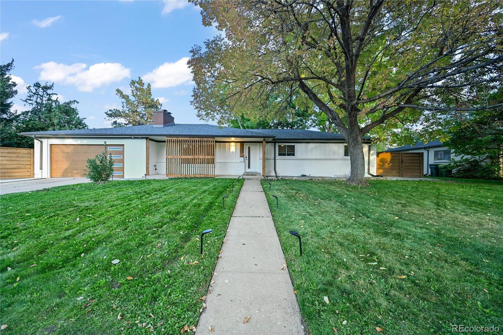 5974 South Pennsylvania Street Centennial, CO 80121 - Photo 2 of 46 a view of a house with a yard
