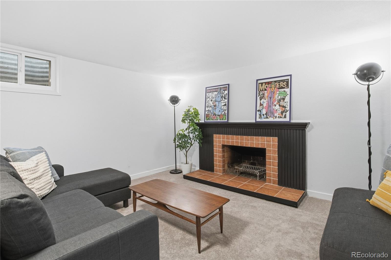 5974 South Pennsylvania Street Centennial, CO 80121 - Photo 22 of 46 a living room with furniture and a fireplace