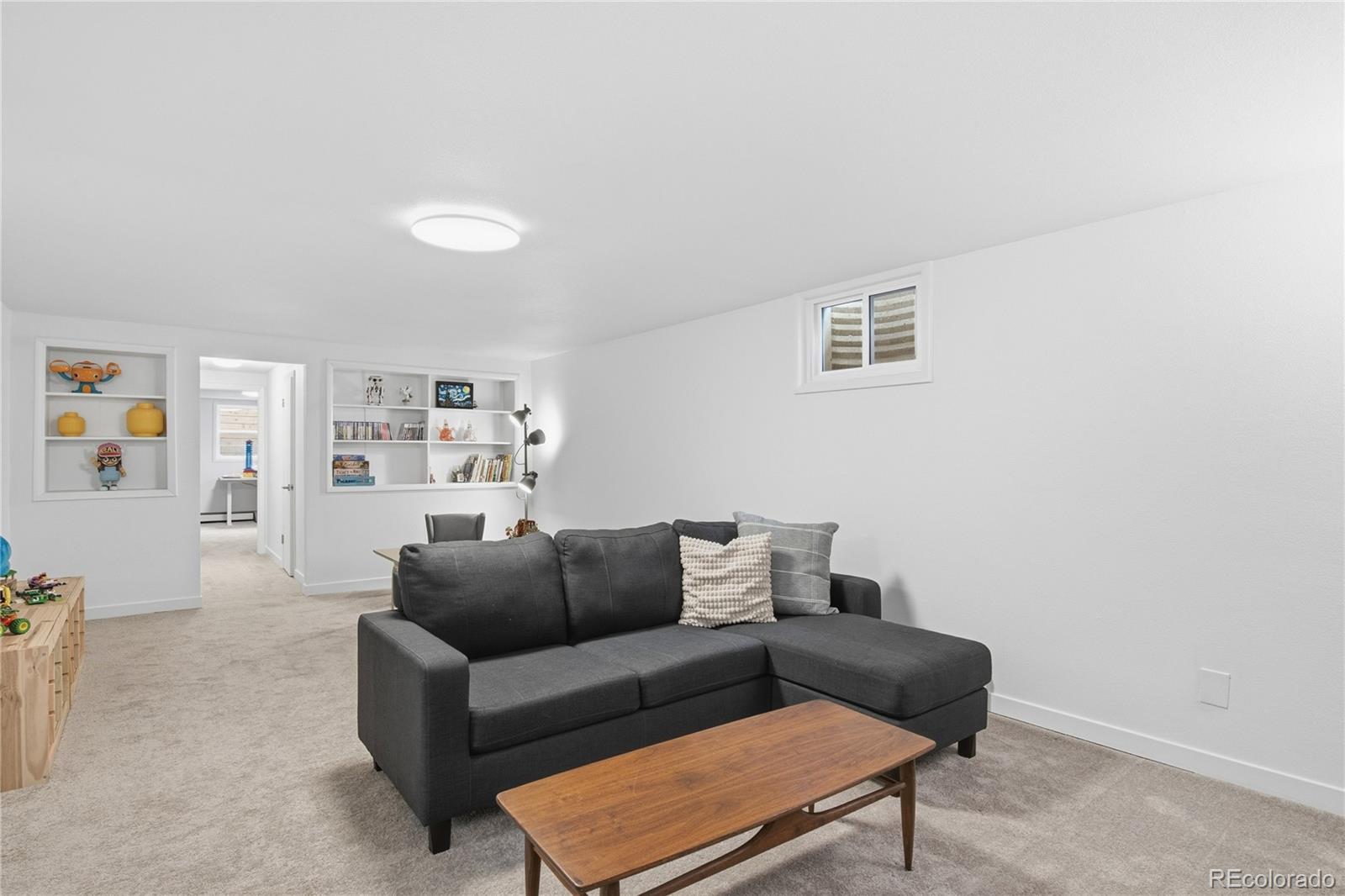5974 South Pennsylvania Street Centennial, CO 80121 - Photo 23 of 46 a living room with furniture and a window