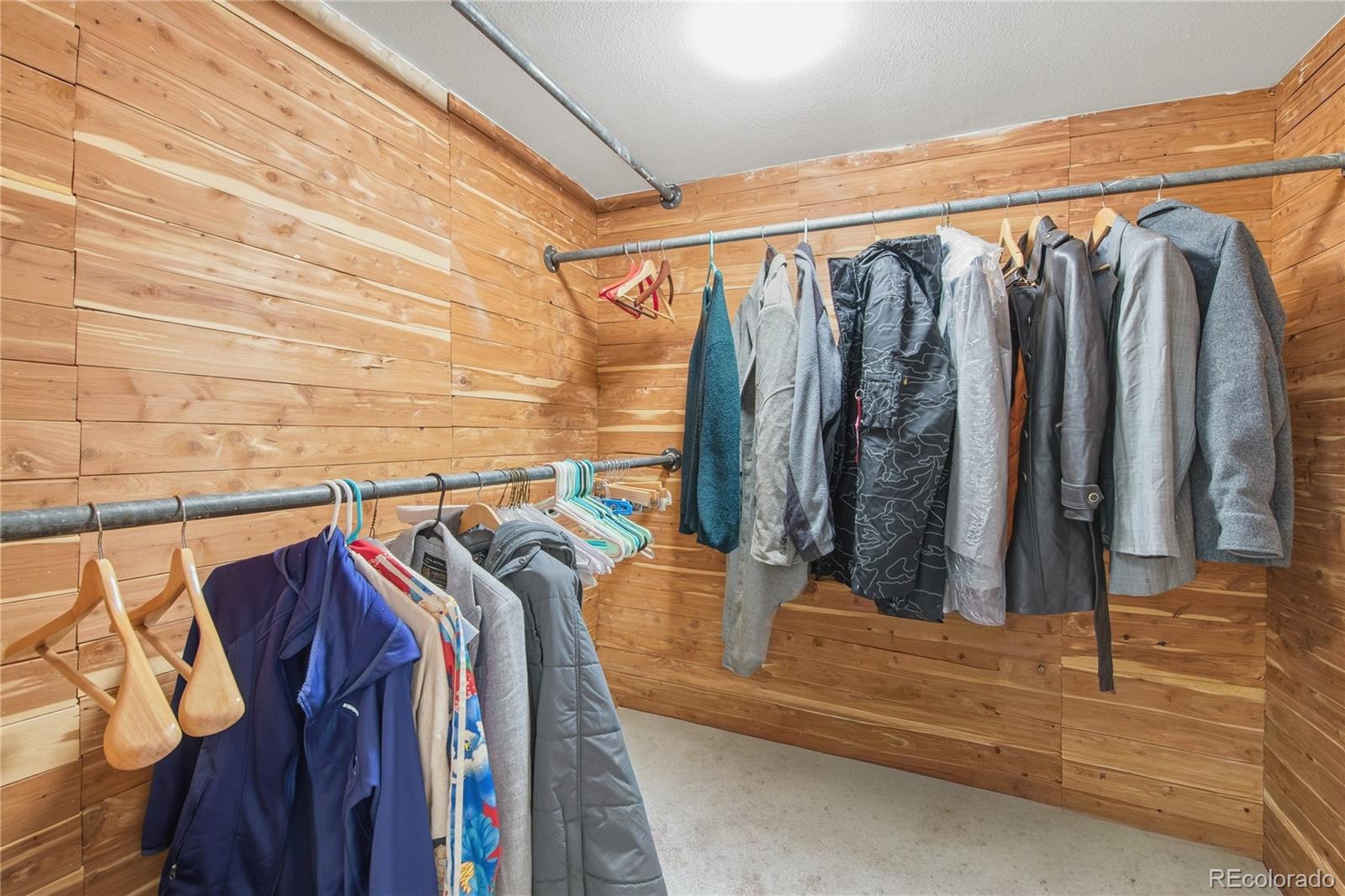 5974 South Pennsylvania Street Centennial, CO 80121 - Photo 29 of 46 a view of walk in closet with clothes