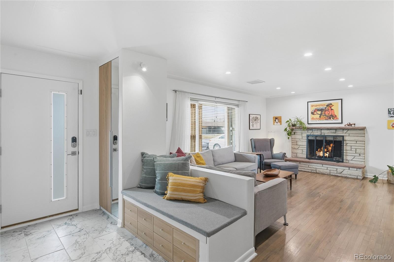 5974 South Pennsylvania Street Centennial, CO 80121 - Photo 3 of 46 a living room with furniture and a fireplace