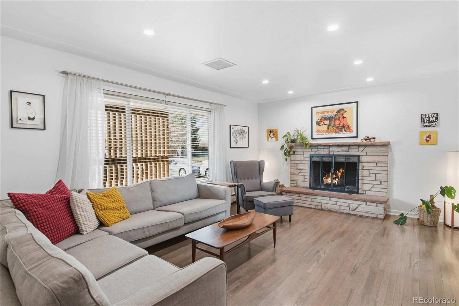 5974 South Pennsylvania Street Centennial, CO 80121 - Photo 4 of 46 a living room with furniture and a fireplace
