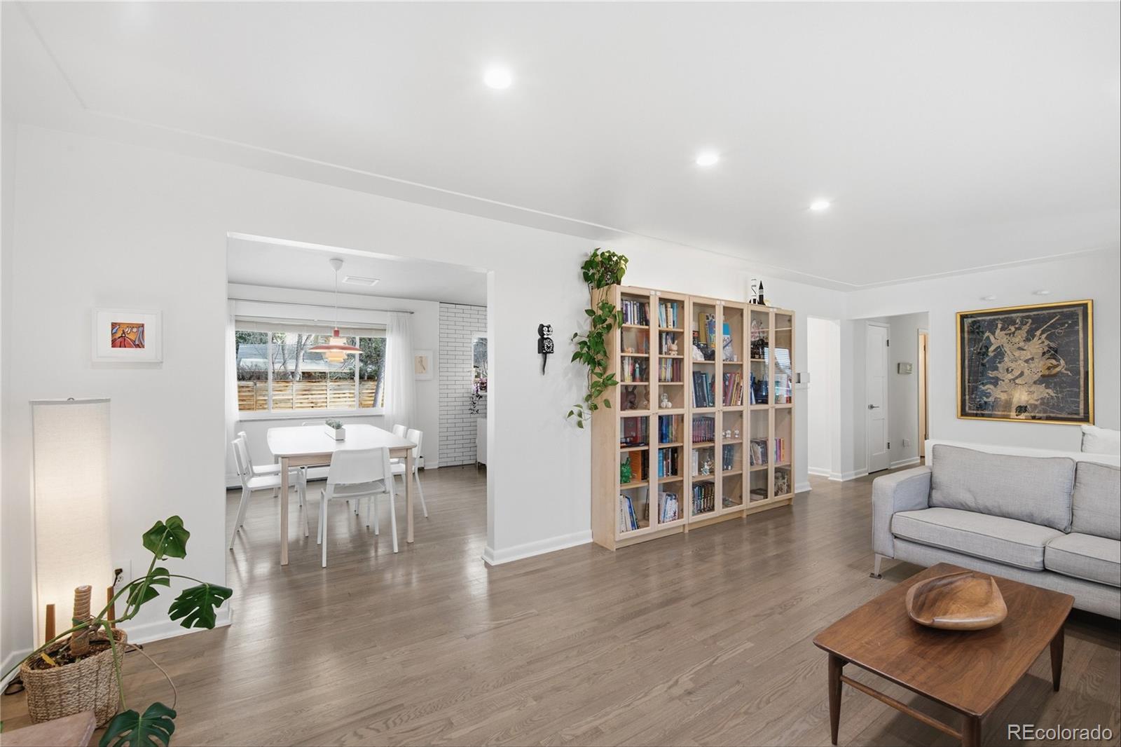 5974 South Pennsylvania Street Centennial, CO 80121 - Photo 6 of 46 a living room with furniture and a book shelf