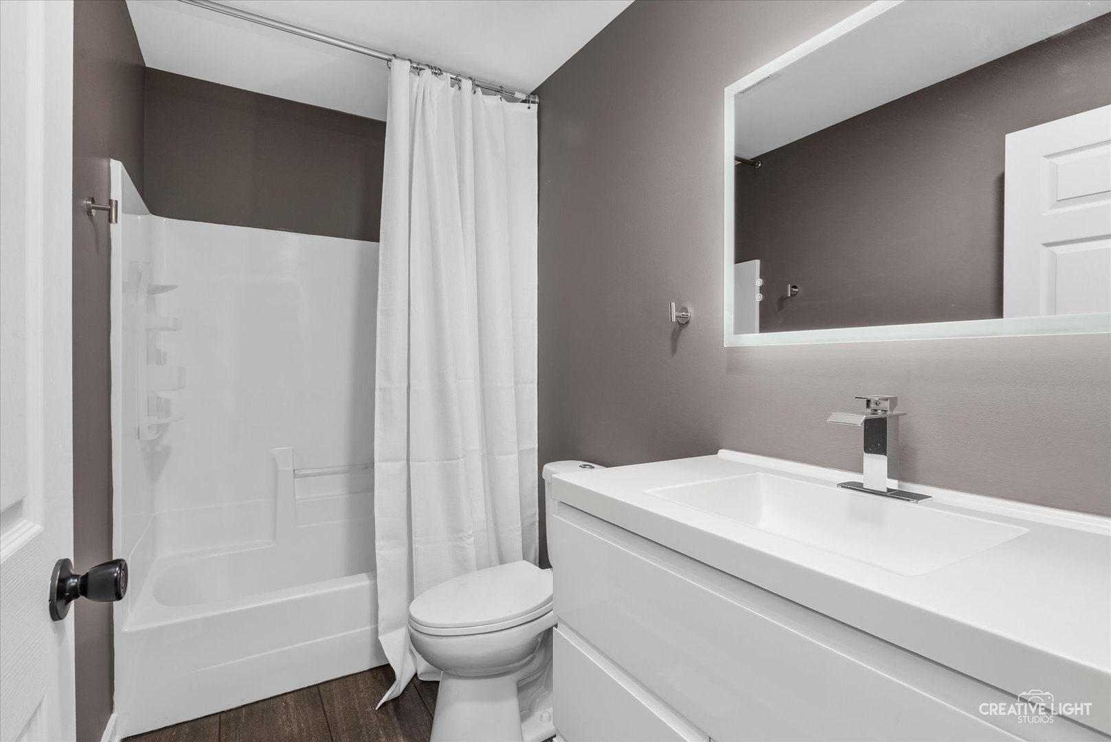 1935 Calla Drive Joliet, IL 60435 - Photo 12 of 17 a bathroom with a sink toilet and shower