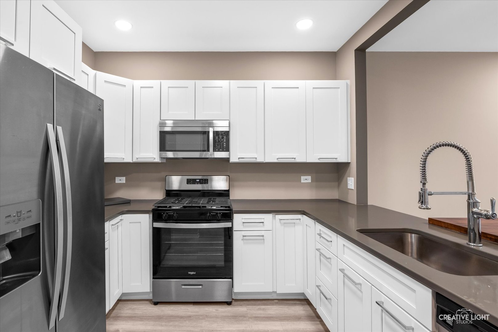 1935 Calla Drive Joliet, IL 60435 - Photo 4 of 17 a kitchen with a sink cabinets and stainless steel appliances