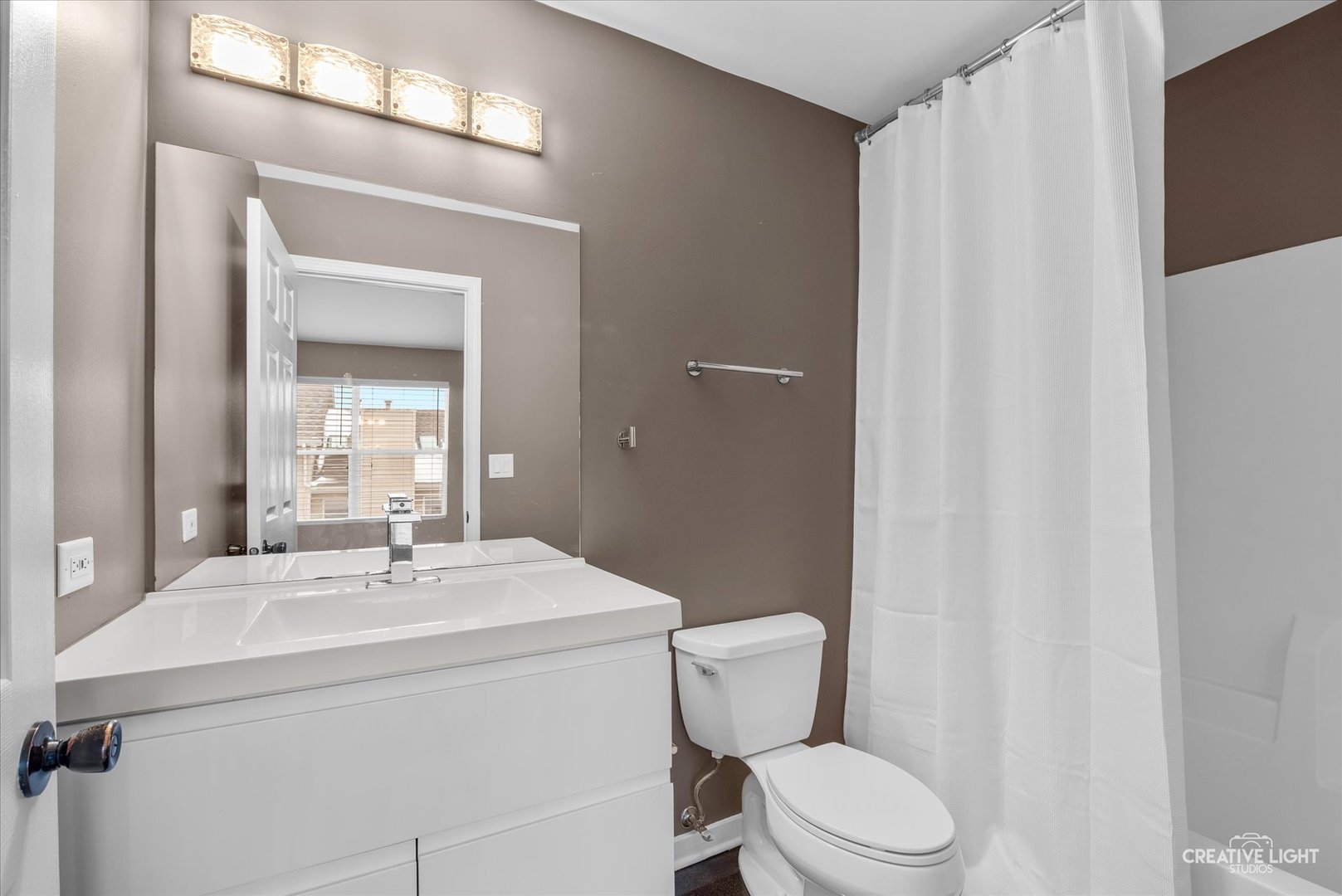 1935 Calla Drive Joliet, IL 60435 - Photo 10 of 17 a bathroom with a sink toilet and mirror